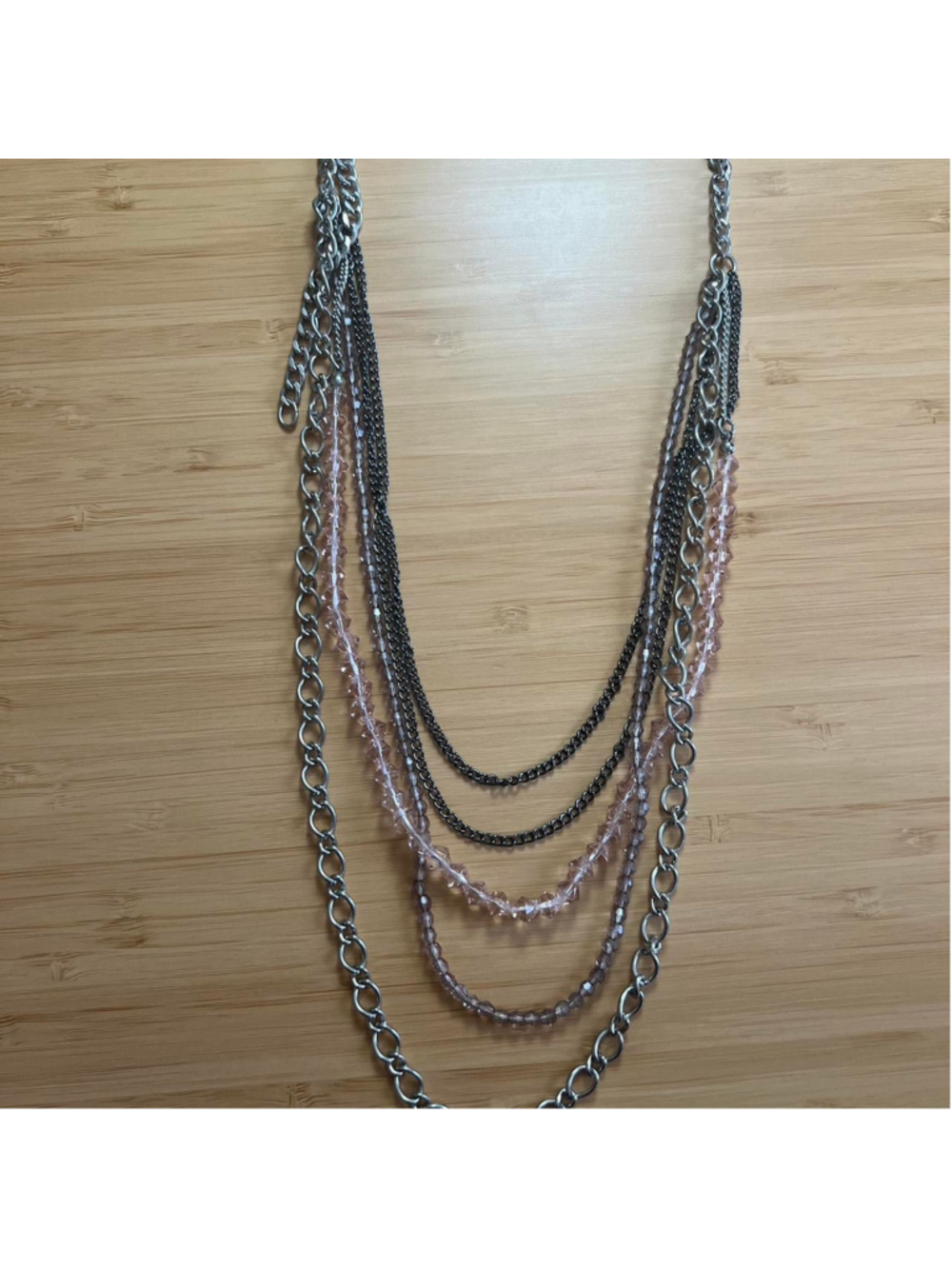 Multi-layered silver necklace with pink beads